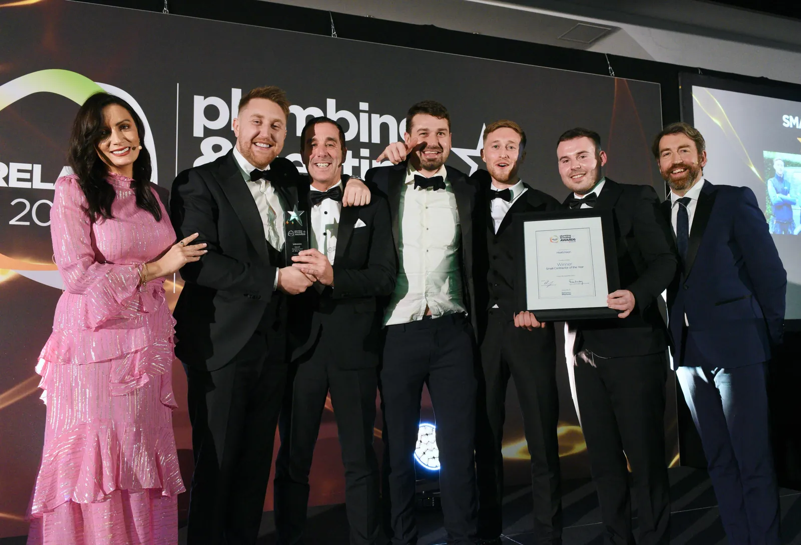 The team on stage with the trophy and certificate at the Plumbing & Heating Awards Ireland 2023