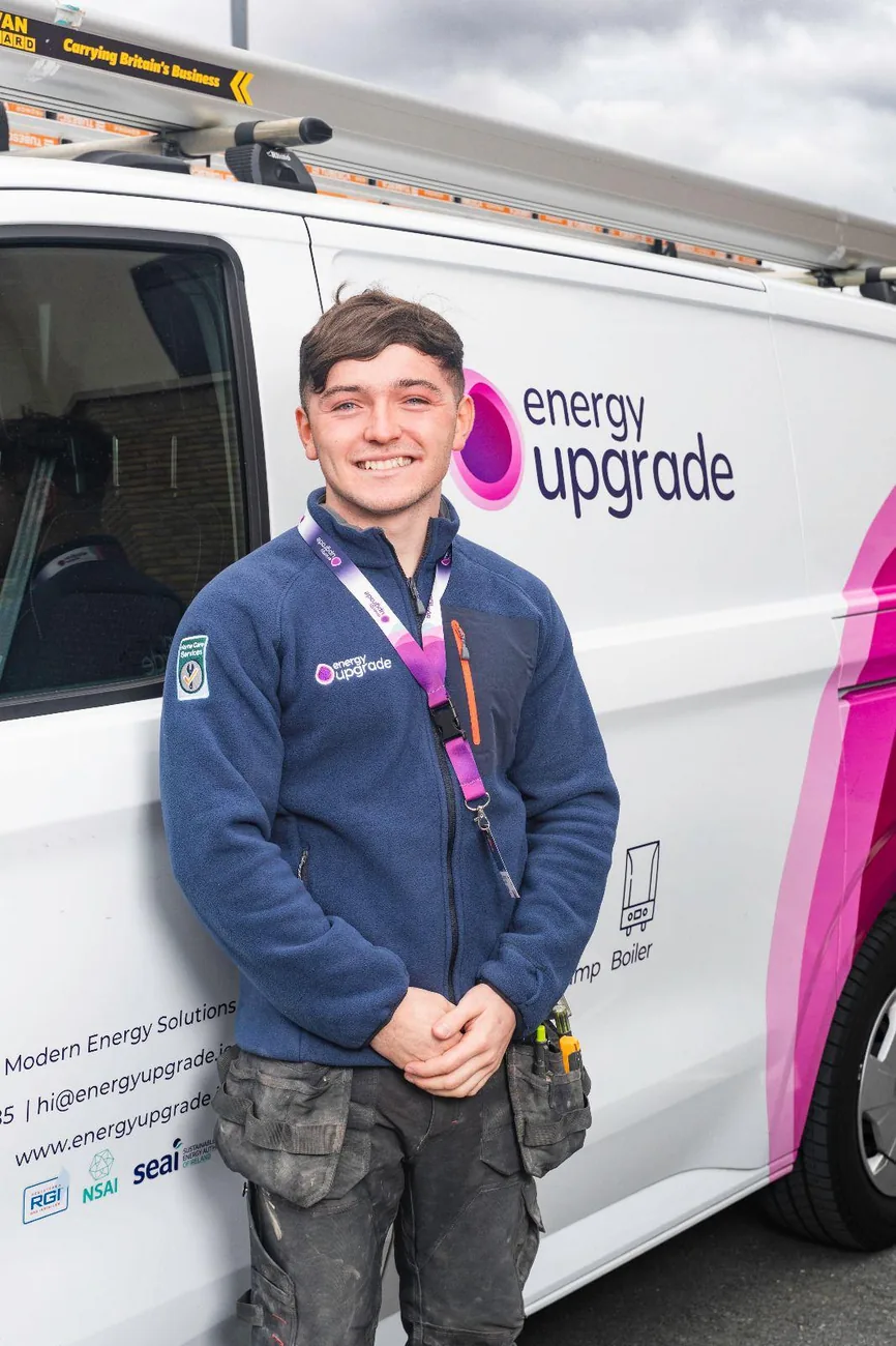 Energy Upgrade engineer in the navy company fleece by a van