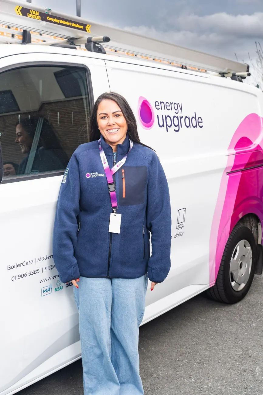 Energy Upgrade team member smiling in the company fleece